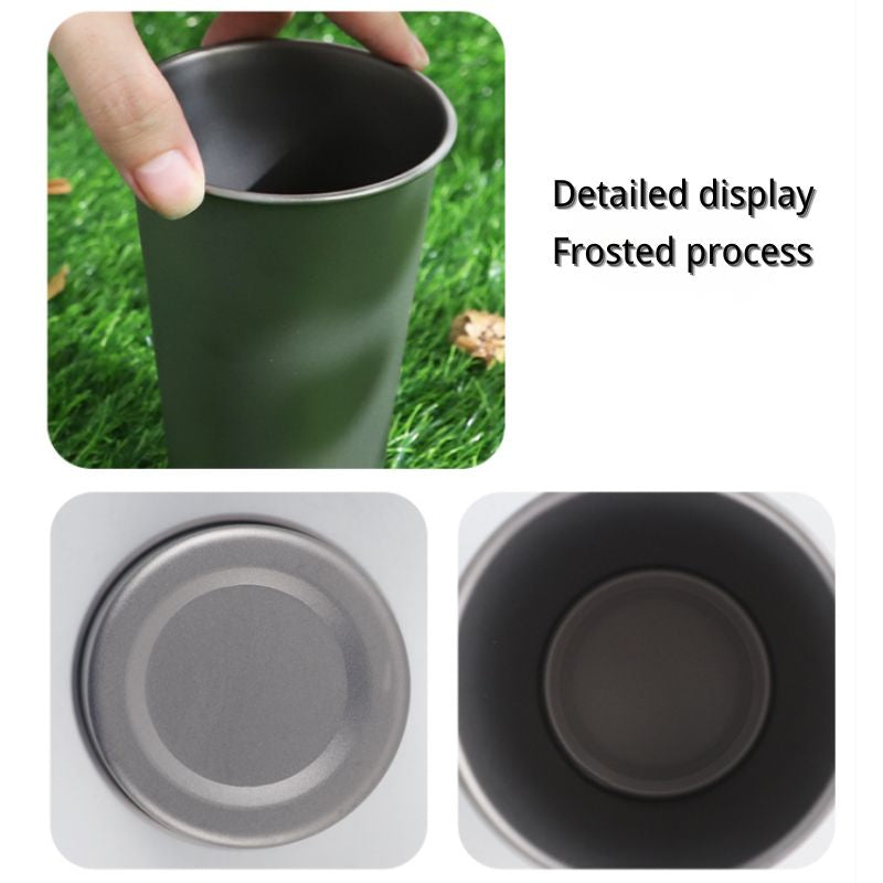 Green cup held by a hand with grass background, showing detailed display of frosted process.