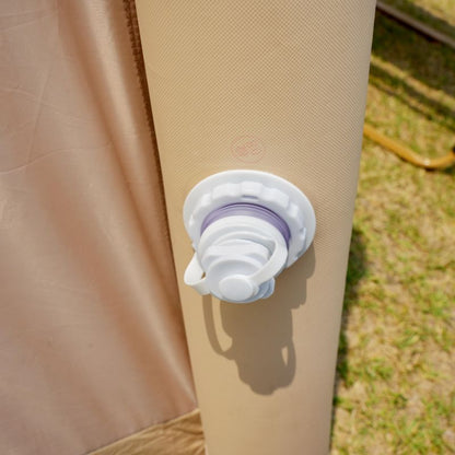 White silicone lid on a beige surface with grass in the background