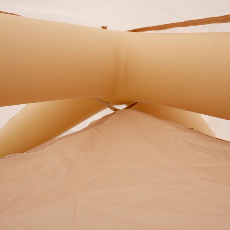 Close-up of beige inflatable pool float with a blurred background