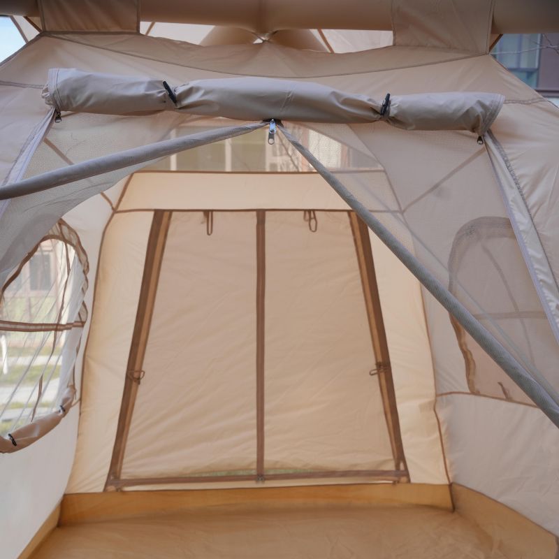 Spacious floor interior of beige 6-person portable inflatable tent, perfect for family camping and easy packing


