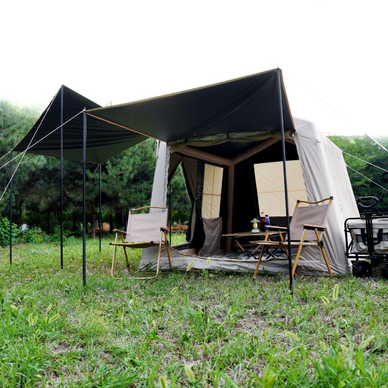 Quick setup beige ridge inflatable tent featuring hexagonal blackout and mesh porch with chairs and table in natural outdoor setting

