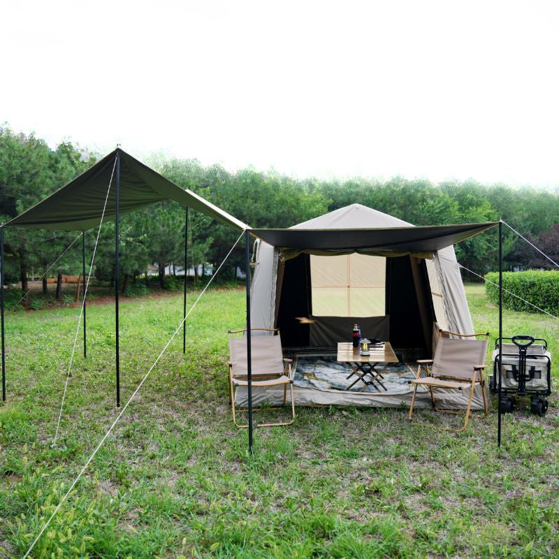 Quick setup beige ridge inflatable tent featuring hexagonal blackout and mesh porch with chairs and table in natural outdoor setting


