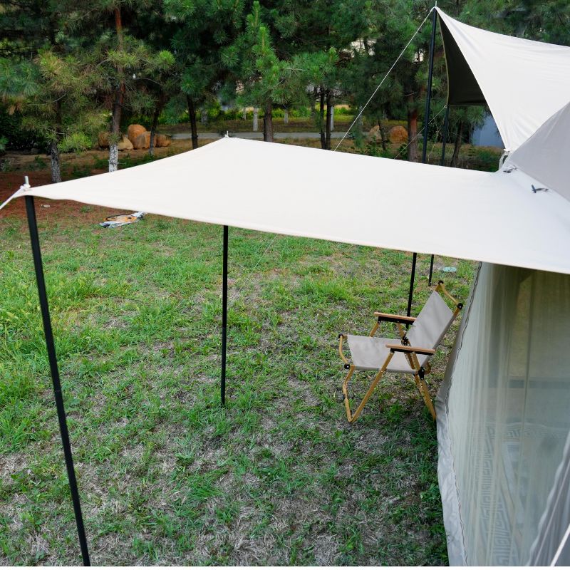 Quick setup beige ridge inflatable tent featuring hexagonal blackout and mesh porch with chairs and table in natural outdoor setting

