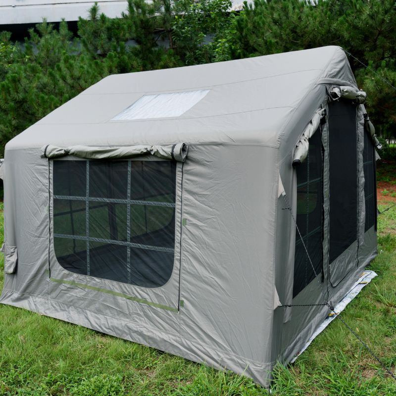 Green 6-8 person large inflatable camping tent with mesh windows and waterproof cover on white background