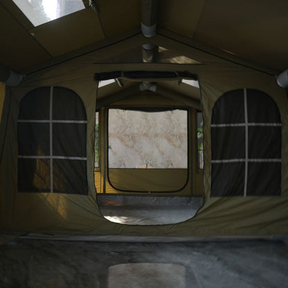 Inside view of a tent with a windowed door leading to an outdoor area.