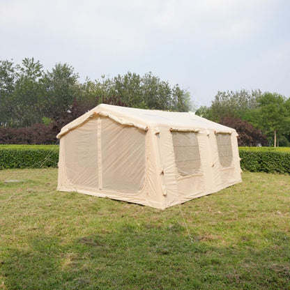 Beige tent with mesh sides on a grassy field with trees in the background