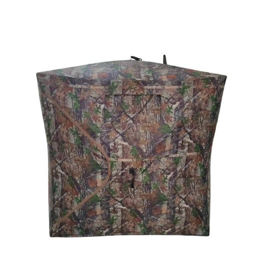 Camouflage cube hub-style hunting blind with 360-degree one-way see-through mesh windows and fiberglass poles on white background