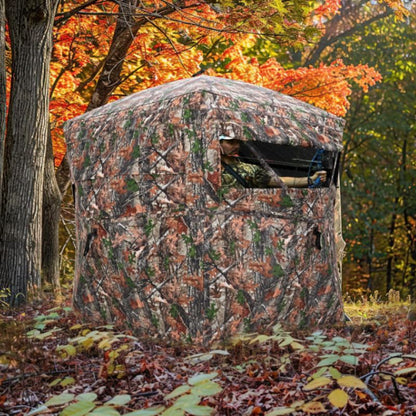 Camouflage hunting blind in a forest during autumn.