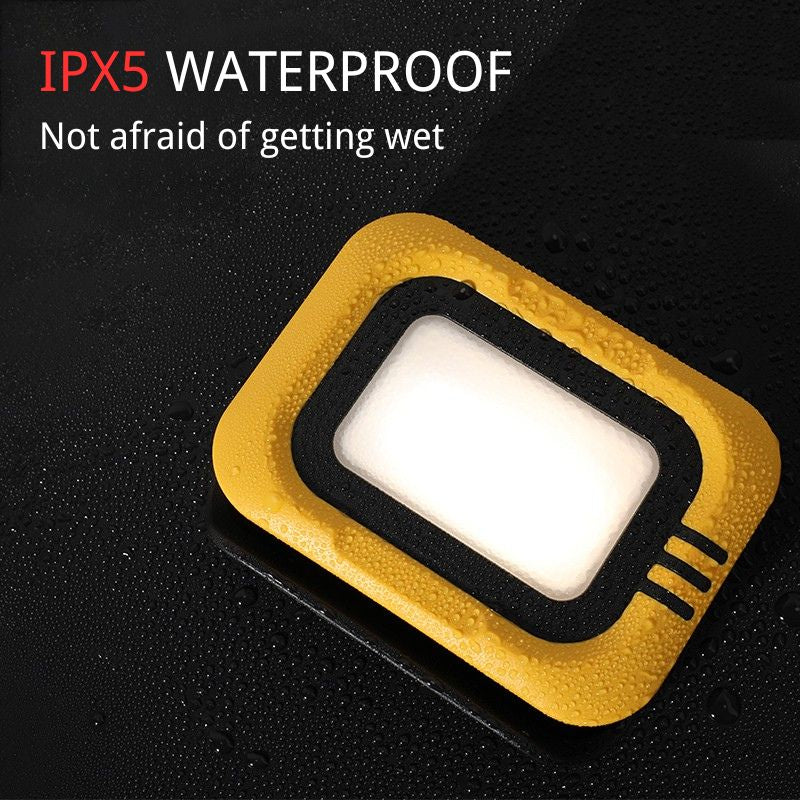 Yellow and black waterproof device on a black background with text indicating IPX5 waterproof rating.
