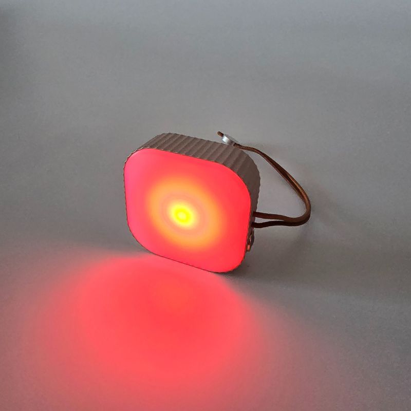 Red light-emitting device on a gray background