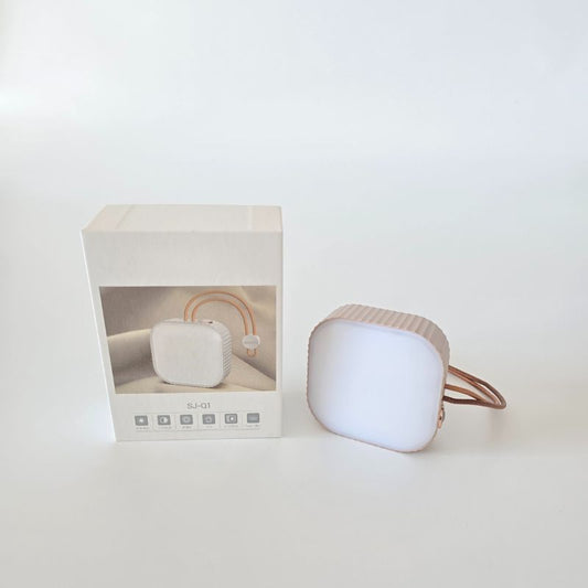 White electronic device with a rainbow design next to its packaging on a white background