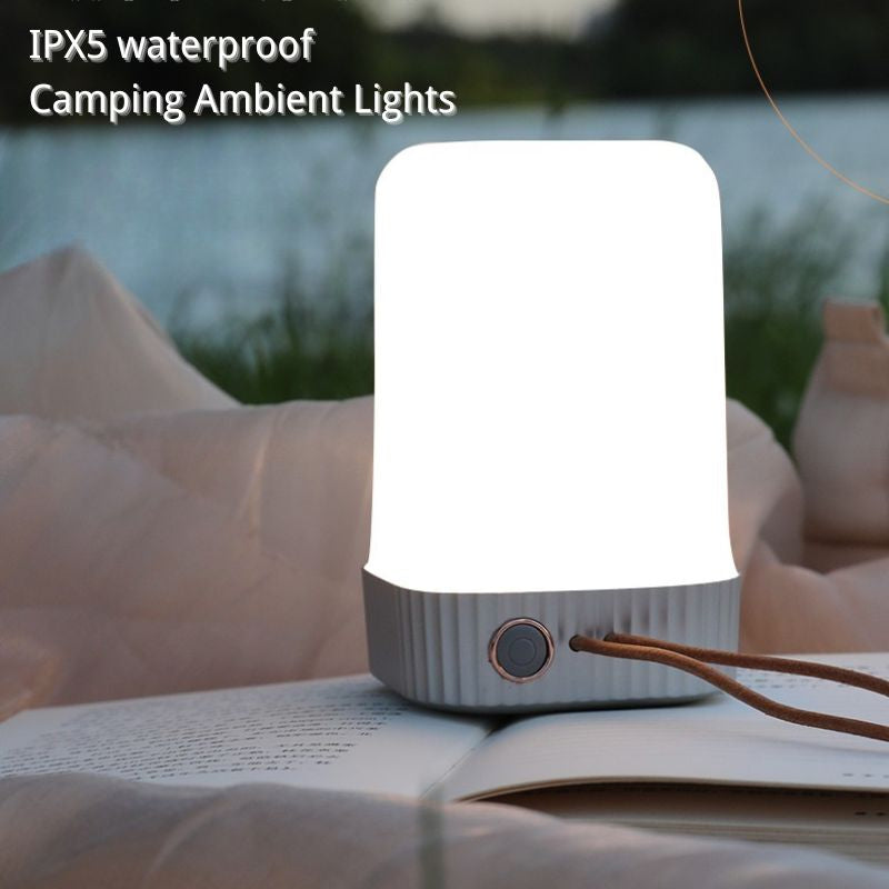Camping ambient light on an open book with IPX5 waterproof text above