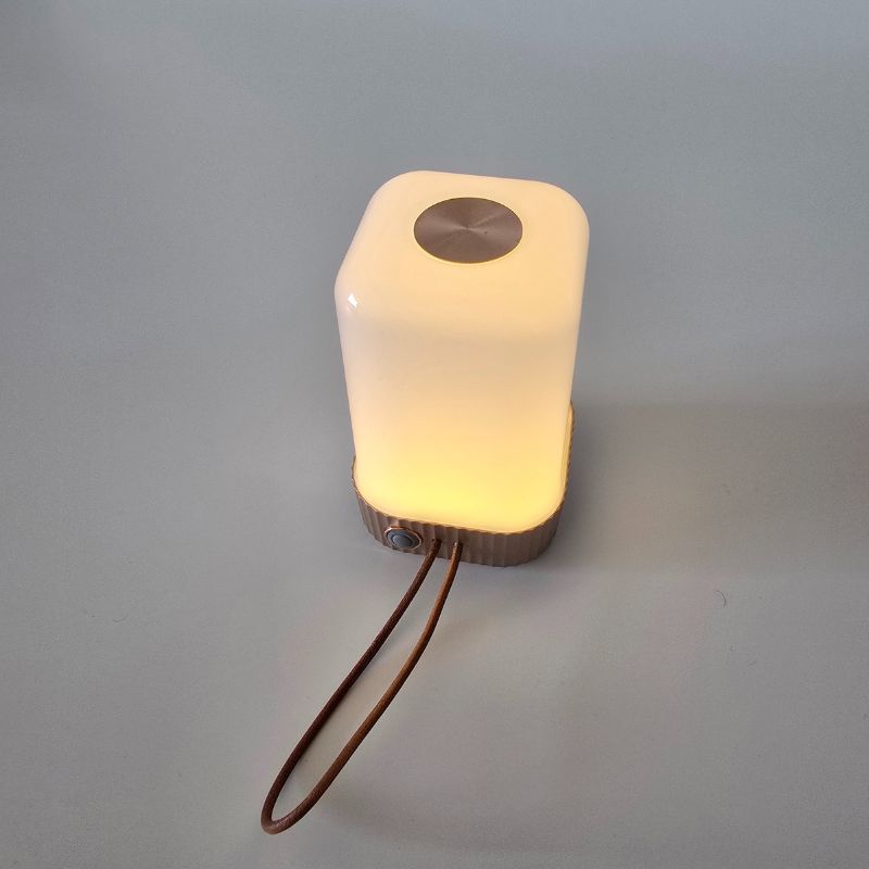 Square-shaped light with a glowing interior on a gray background