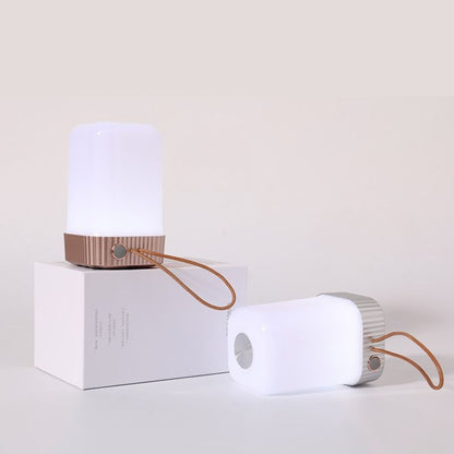 Portable lamp with a white base and brown accents on a light beige background