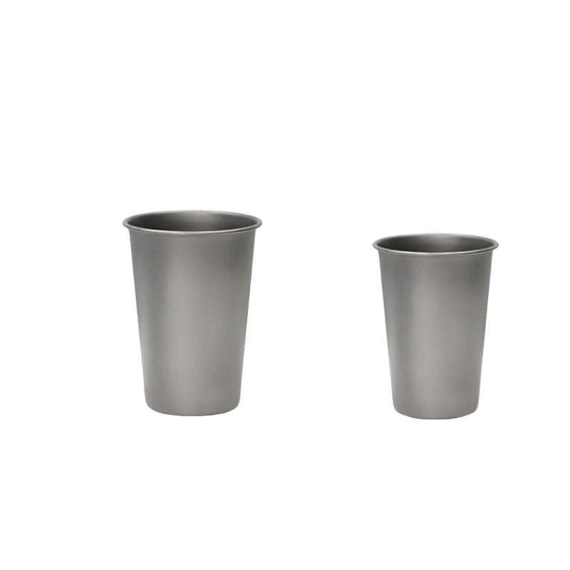 Two gray metal cups on a white background