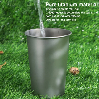 Titanium cup on grass with water being poured, text about titanium material properties.