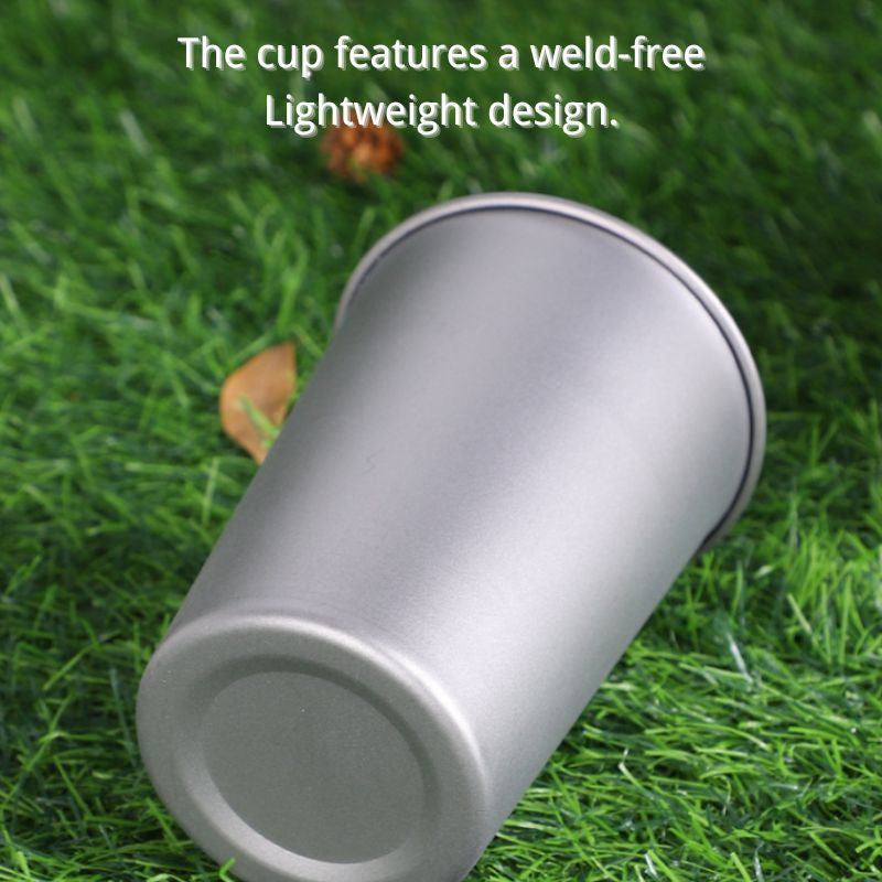 Silver cup on grass with text about weld-free design