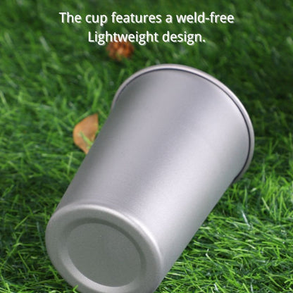 Silver cup on grass with text about weld-free design
