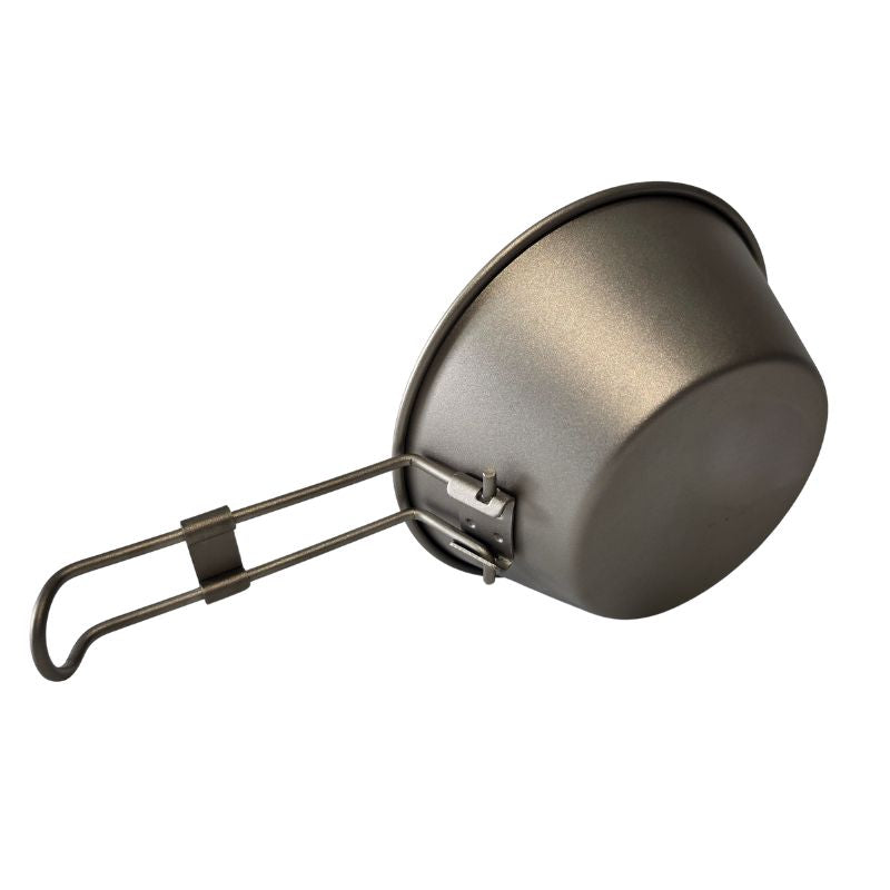 Metal camping pot with handle on a white background