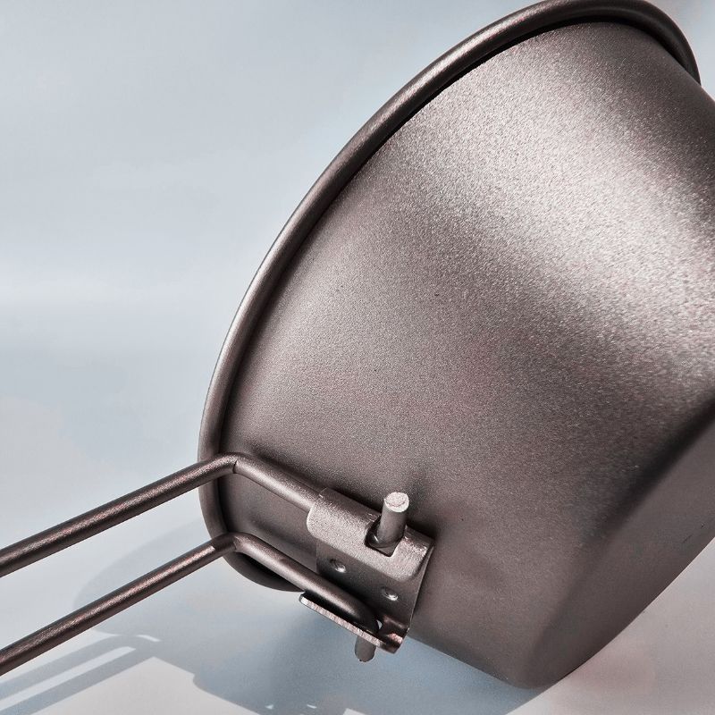 Close-up of a metallic lampshade with a blurred background