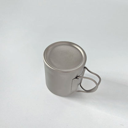 Metal mug with handle on a white background
