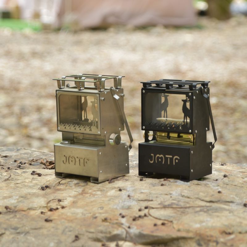 Durable outdoor kerosene lantern stove with carbon steel construction, deer motif glass panels, and dual-purpose cooking capability

