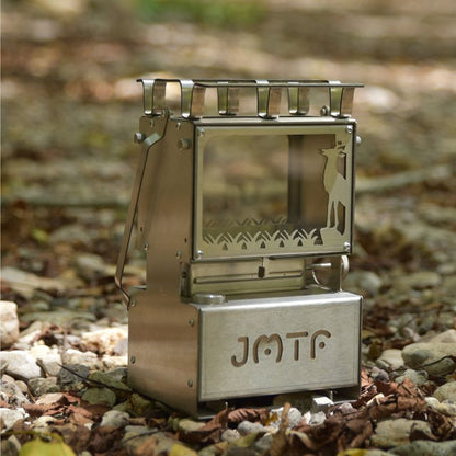 Portable metal stove with 'JMTF' branding on a natural background