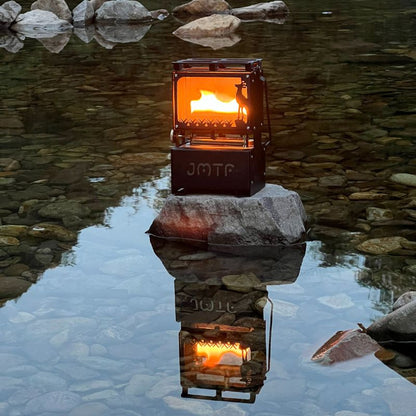 Portable stove with visible brand logo on a rock in a reflective water setting