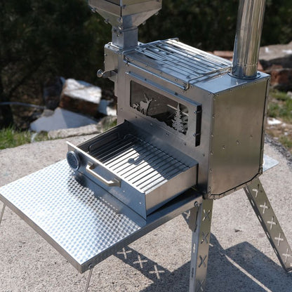 Portable metal grill on a stand outdoors with trees in the background