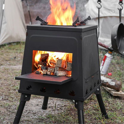 Black metal stove with flames and firewood inside, set against a natural outdoor background.