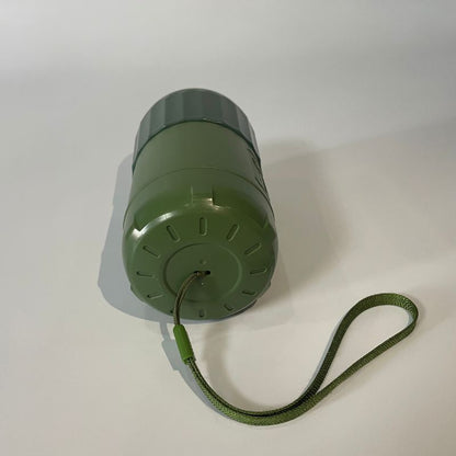 Green container with a rope on a white background