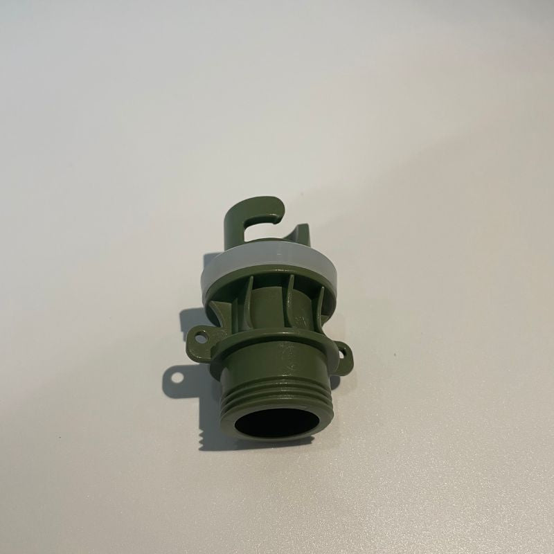 Green plastic fitting on a white background