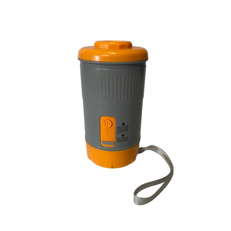 Gray and orange portable coffee maker with a handle on a white background