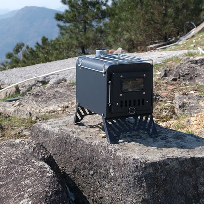 Portable stove on a rock with a mountainous background