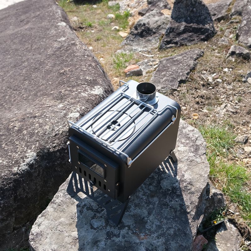 Portable stove on a rock with natural outdoor background