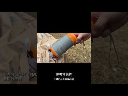 Close-up of the GR-152 wireless high-speed inflator being secured to a beige camping tent for fast inflation