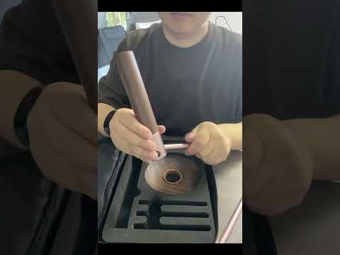 Unboxing and assembly of the Boertala walnut camping light. A user unzips the beige carrying case, removes the foam-packed components, screws together the metal tripod legs and wooden base, and hangs the LED lantern with its walnut shade on the hook stand